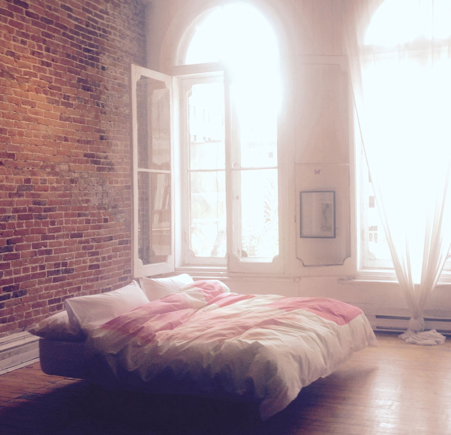ZayZay-duvet-cover-design-So-Jess-featured-in-a-bedroom-with-brick-walls-and-tall-Victorian-white-frame-windows