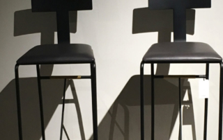 Two-minimalist-designer-bar-chairs-at-High-Point-Market