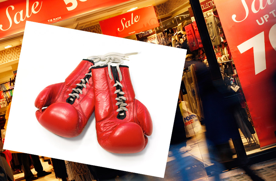 Boxing-gloves-on-top-of-store-with-red-boxing-day-sale-signs
