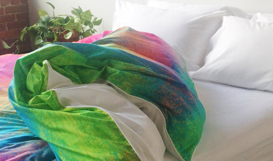 ZayZay Tropical Frost painting on duvet cover in sunny bedroom